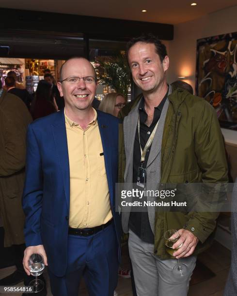IMDb Founder and CEO Col Needham and Trevor Groth attend IMDb's 2018 Cannes Dinner Party during the 71st Annual Cannes Film Festival at Table 22 on...