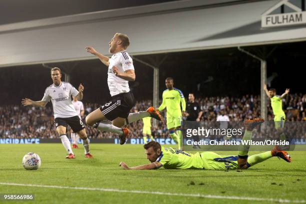 Tomas Kalas of Fulham flies through the air as he trips on a prone Andreas Weimann of Derby during the Sky Bet Championship Play Off Semi...