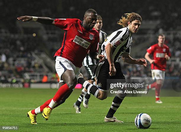 Ishmael Miller of West Bromwich Albion beats Fabricio Coloccini of Newcastle United during the Coca-Cola Championship match between Newcastle United...