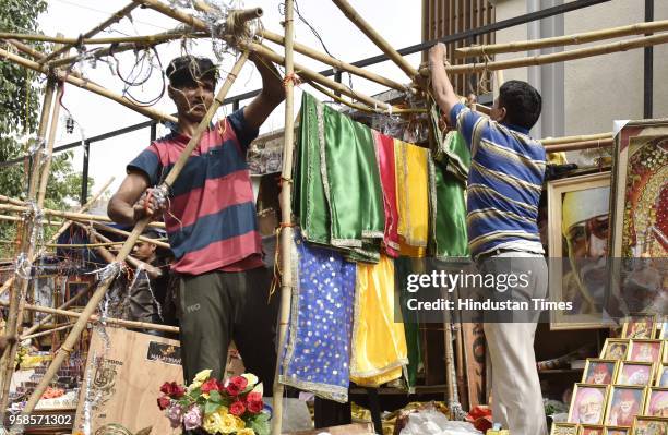 Workers remove encroachment from the footpath during the anti-encroachment drive at Sai Mandir, Lodhi Road on May 14, 2018 in New Delhi, India.