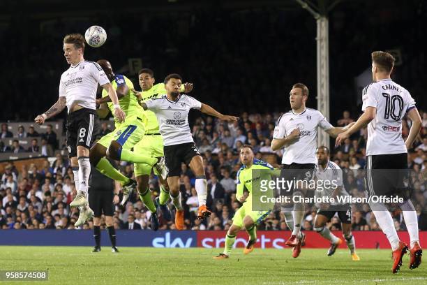 Stefan Johansen of Fulham, Andre Wisdom of Derby and Ryan Fredericks of Fulham go up for a header during the Sky Bet Championship Play Off Semi...