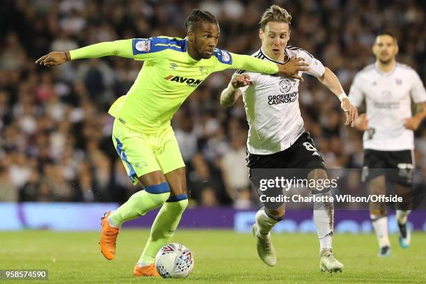 Kasey Palmer of Derby and Stefan Johansen of Fulham battle for the ball during the Sky Bet Championship Play Off Semi Final:Second Leg match between...