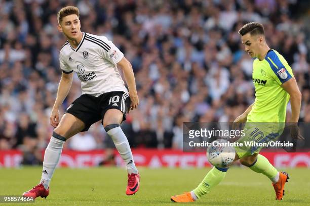 Tom Cairney of Fulham puts the ball past Tom Lawrence of Derby during the Sky Bet Championship Play Off Semi Final:Second Leg match between Fulham...