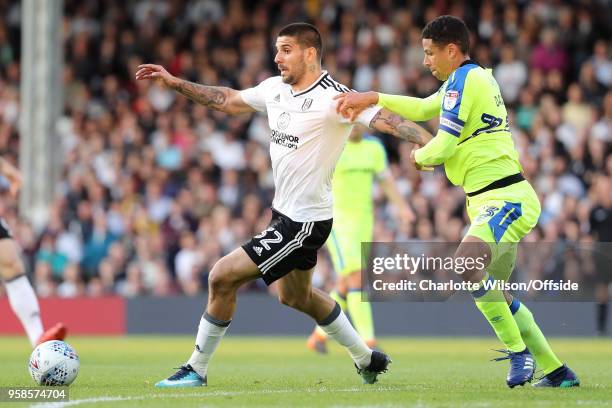 Aleksander Mitrovic of Fulham holds Curtis Davies of Derby back during the Sky Bet Championship Play Off Semi Final:Second Leg match between Fulham...