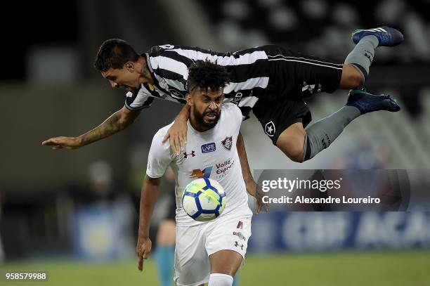 Kiesa of Botafogo struggles for the ball with Renato Chaves of Fluminense during the match between Botafogo and Fluminense as part of Brasileirao...