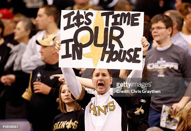 Fan of the New Orleans Saints holds up a sign which reads "It's Our Time In Our House" against the Arizona Cardinals during the NFC Divisional...
