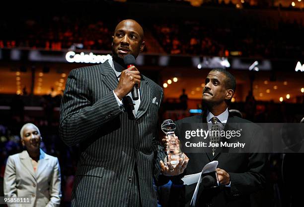 Television personality David Aldridge presents former NBA player Alonzo Mourning with the National Civil Rights Museum Sports Legacy Award before a...