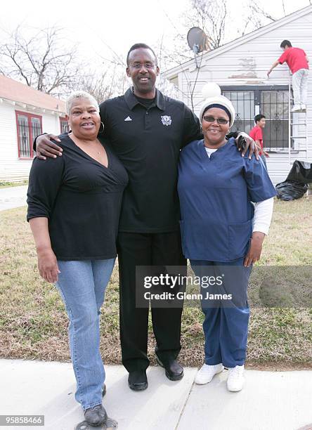 Former NBA star Rolando Blackman poses with the beneficiaries of some home repairs as part of the NBA Cares initiative on January 18, 2010 in Dallas,...
