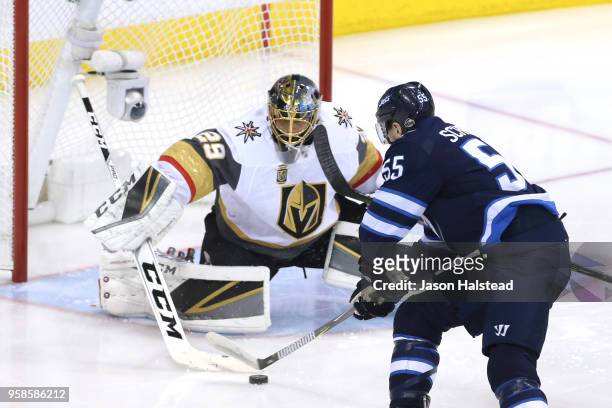 Marc-Andre Fleury of the Vegas Golden Knights stops a shot from Mark Scheifele of the Winnipeg Jets during the first period in Game Two of the...
