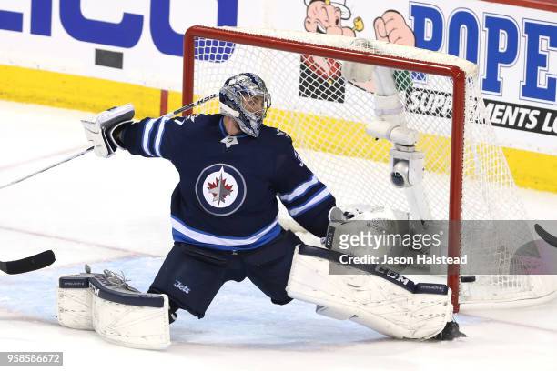 Connor Hellebuyck of the Winnipeg Jets allows a first period goal to Tomas Tatar of the Vegas Golden Knights in Game Two of the Western Conference...