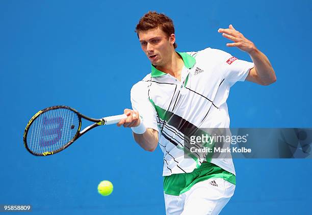 Daniel Brands of Great Britain plays a forehand in his first round match against Evgeny Korolev of Kazakhstan during day two of the 2010 Australian...