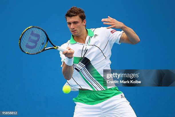 Daniel Brands of Great Britain plays a forehand in his first round match against Evgeny Korolev of Kazakhstan during day two of the 2010 Australian...