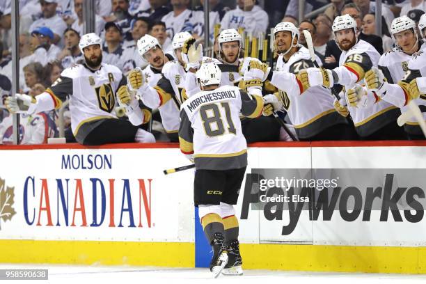 Jonathan Marchessault of the Vegas Golden Knights is congratulated by his teammates after scoring a first period goal against the Winnipeg Jets in...