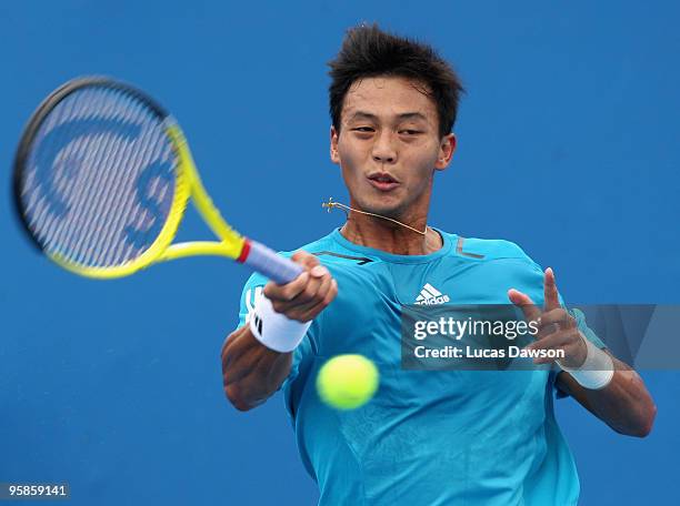 Yen-Hsun Lu of Chinese Taipei plays a forehand in his first round match against Louk Sorensen of Ireland during day two of the 2010 Australian Open...