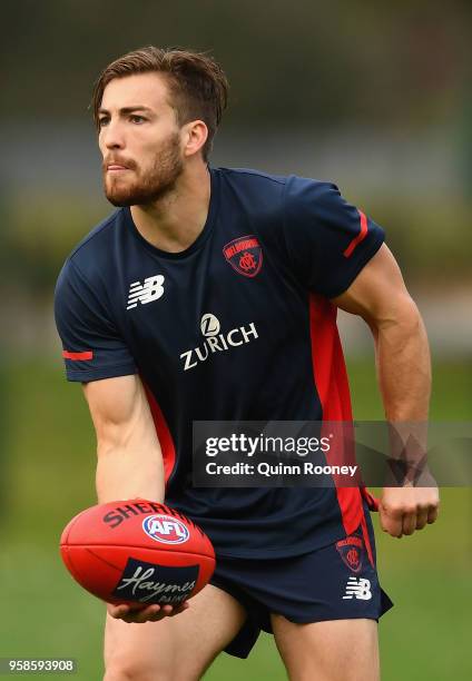 Jack Viney of the Demons handballs during a Melbourne Demons AFL training session at Gosch's Paddock on May 15, 2018 in Melbourne, Australia.