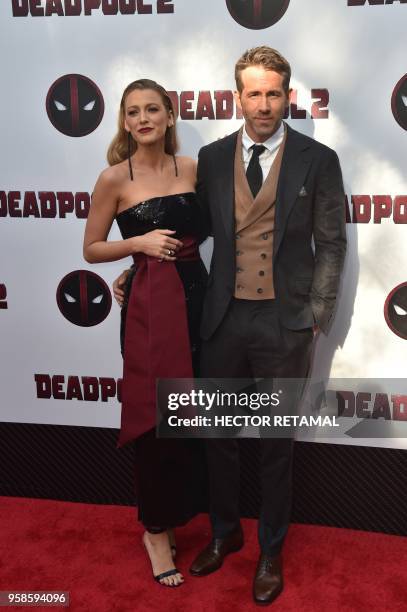 Actor Ryan Reynolds and his wife actress Blake Lively pose for a picture on the red carpet during the special screening of "Deadpool 2" at AMC Loews...