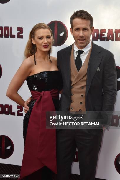 Actor Ryan Reynolds and his wife actress Blake Lively pose for a picture on the red carpet during the special screening of "Deadpool 2" at AMC Loews...
