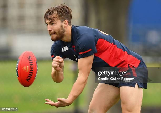 Jack Viney of the Demons handballs during a Melbourne Demons AFL training session at Gosch's Paddock on May 15, 2018 in Melbourne, Australia.