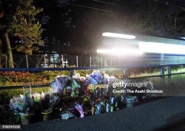 Train runs past a site where the body of 7-year-old Tamaki Omomo was found after suspect Haruka Kobayashi was arrested on May 14, 2018 in Niigata,...