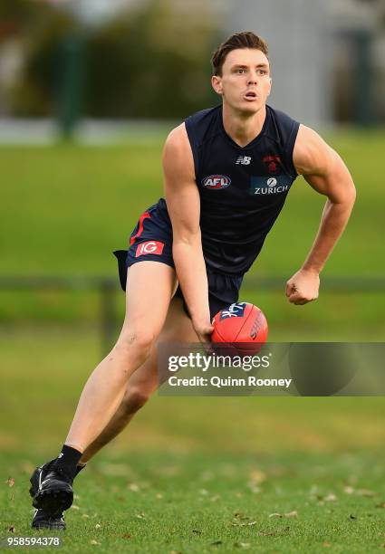 Jake Lever of the Demons handballs during a Melbourne Demons AFL training session at Gosch's Paddock on May 15, 2018 in Melbourne, Australia.