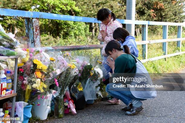 People offer flowers at where the body of 7-year-old Tamaki Omomo was found on May 14, 2018 in Niigata, Japan. A 23-year-old man was arrested in...