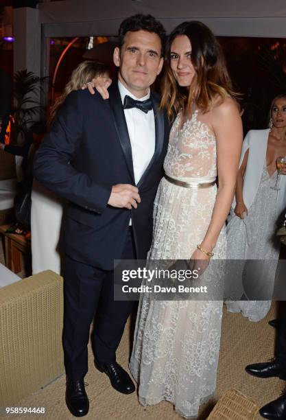 Matt Dillon and Roberta Mastromichele pose at Nikki Beach for the Perrier Jouet celebration of "The House that Jack Built" on May 14, 2018 in Cannes,...