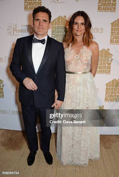 Matt Dillon and Roberta Mastromichele pose at Nikki Beach for the Perrier Jouet celebration of "The House that Jack Built" on May 14, 2018 in Cannes,...