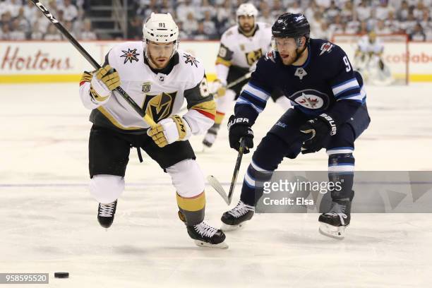 Jonathan Marchessault of the Vegas Golden Knights is defended by Andrew Copp of the Winnipeg Jets during the first period in Game Two of the Western...