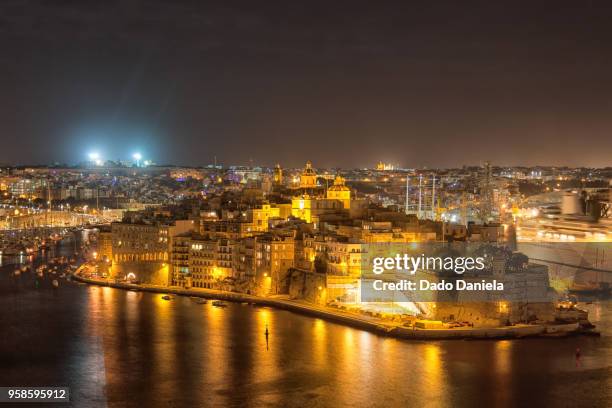 night panorama of valletta - st julians bay stock pictures, royalty-free photos & images
