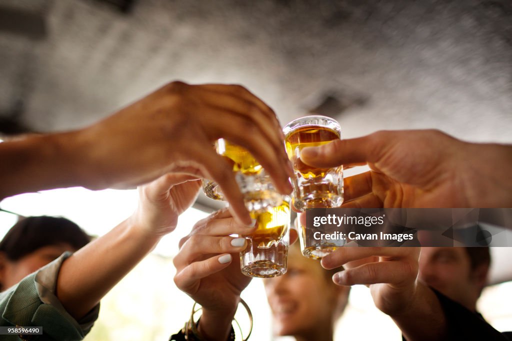 Friends enjoying tequila in bar