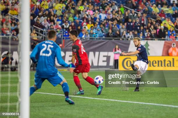 May 12: Diego Fagundez of New England Revolution has his shot saved by Alex Bono of Toronto FC during the New England Revolution Vs Toronto FC...