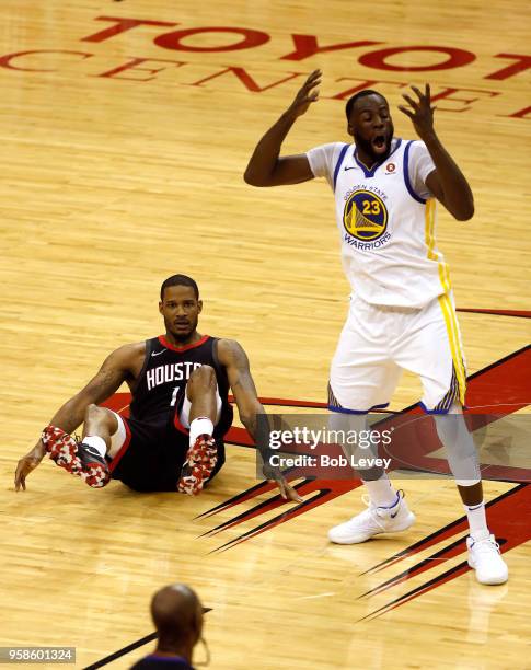 Draymond Green of the Golden State Warriors reacts after being called for a foul in the second quarter on Trevor Ariza of the Houston Rockets in Game...