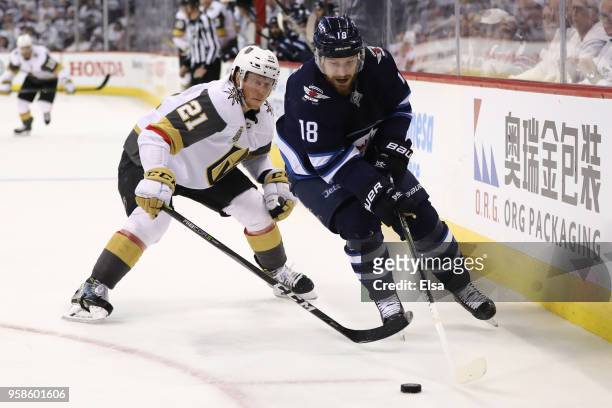Bryan Little of the Winnipeg Jets is pursued by Cody Eakin of the Vegas Golden Knights during the second period in Game Two of the Western Conference...
