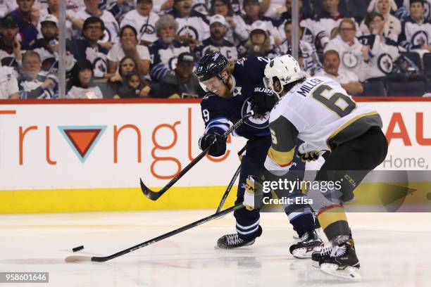 Patrik Laine of the Winnipeg Jets takes a shot against Colin Miller of the Vegas Golden Knights during the second period in Game Two of the Western...