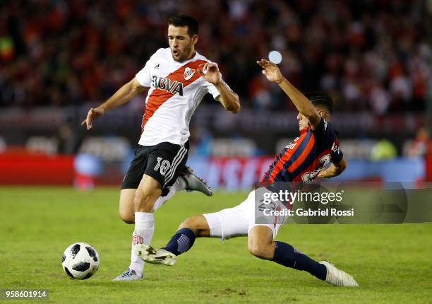 Camilo Mayada of River Plate fights for the ball with German Berterame of San Lorenzo during a match between River Plate and San Lorenzo as part of...