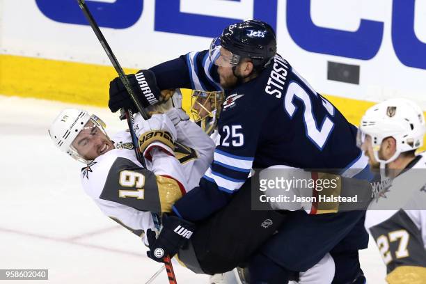 Reilly Smith of the Vegas Golden Knights is checked by Paul Stastny of the Winnipeg Jets during the second period in Game Two of the Western...
