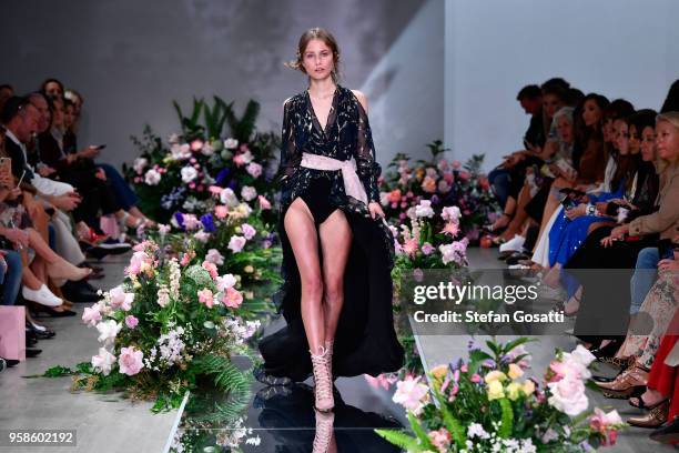 Model walks the runway during the We Are Kindred show at Mercedes-Benz Fashion Week Resort 19 Collections at Carriageworks on May 15, 2018 in Sydney,...