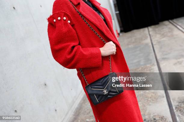 Kash O'Hara wearing Mother of Pearl coat, Balmain top, Rebecca Minkoff mules and Chanel bag during Mercedes-Benz Fashion Week Resort 19 Collections...