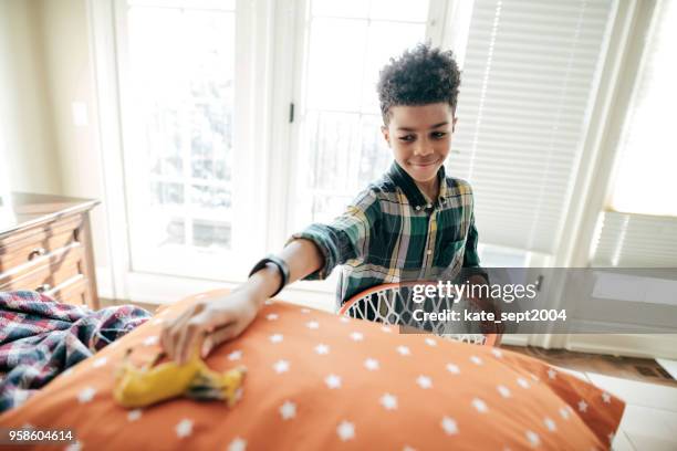 boy cleaning his room - kids room stock pictures, royalty-free photos & images
