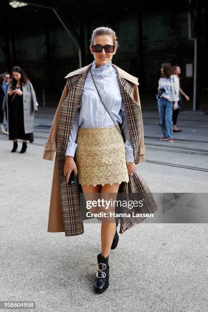 Kate Waterhouse wearing Macgraw top and skirt and Gucci trench coat during Mercedes-Benz Fashion Week Resort 19 Collections at Carriageworks on May...