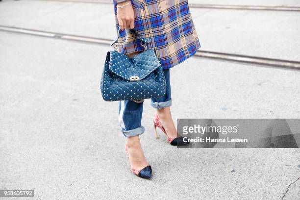 Guest wearing Rag and Bone jacket, Gucci sunglasses, Calvin Klein jeans, Velentino bag and Dior shoes during Mercedes-Benz Fashion Week Resort 19...