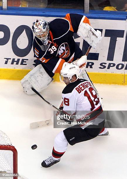 Niclas Bergfors of the New Jersey Devils pressures Rick DiPietro of the New York Islanders on January 18, 2010 at Nassau Coliseum in Uniondale, New...