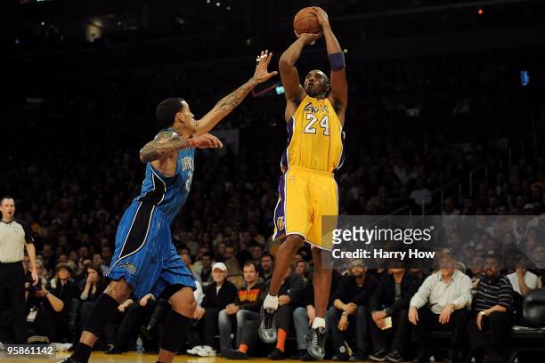 Kobe Bryant of the Los Angeles Lakers shoots against Matt Barnes of the Orlando Magic in the first quarter during the game on January 18, 2010 at...
