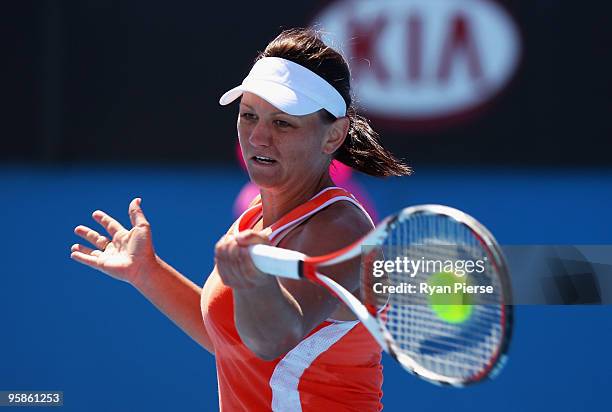 Casey Dellacqua of Australia plays a forehand in her first round match against Anastasiya Yakimova of Belarus during day two of the 2010 Australian...