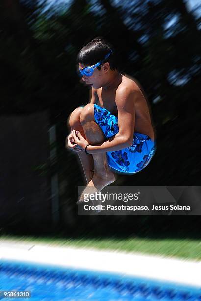 young boy diving into water - jesus is alive stock-fotos und bilder