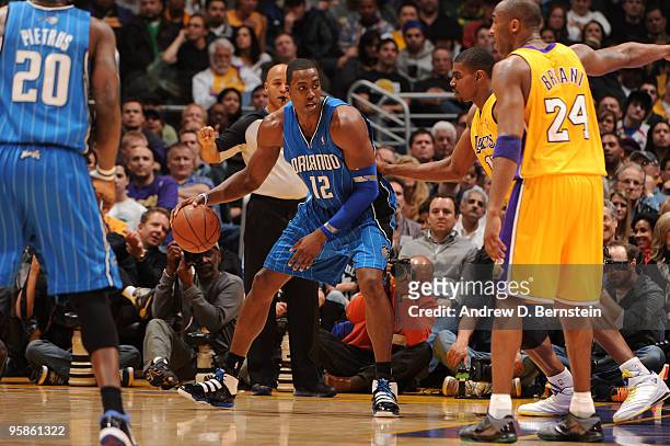 Dwight Howard of the Orlando Magic posts up against Andrew Bynum of the Los Angeles Lakers at Staples Center on January 18, 2010 in Los Angeles,...