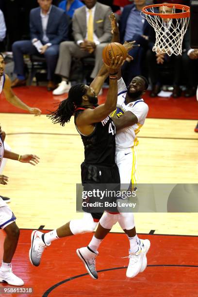 Nene Hilario of the Houston Rockets drives to the basket against Draymond Green of the Golden State Warriors in the second half in Game One of the...