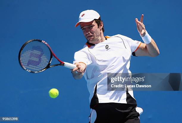Teimuraz Gabashvili of Russia plays a forehand in his first round match against Thomaz Bellucci of Brazil during day two of the 2010 Australian Open...