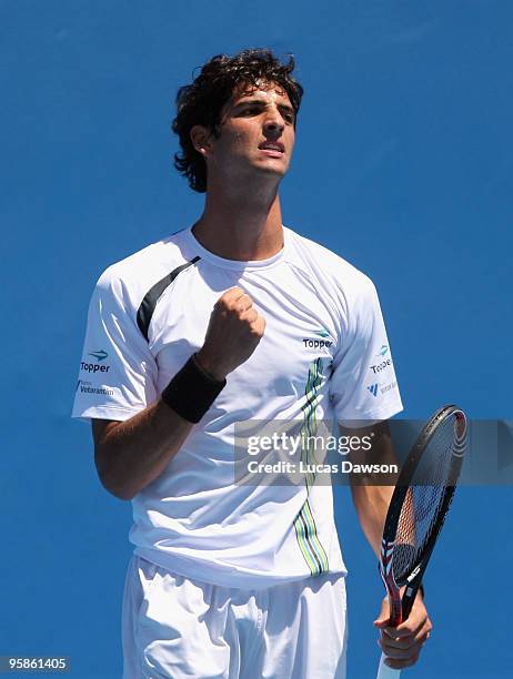 Thomaz Bellucci of Brazil celebrates winning a point in his first round match against Teimuraz Gabashvili of Russia during day two of the 2010...