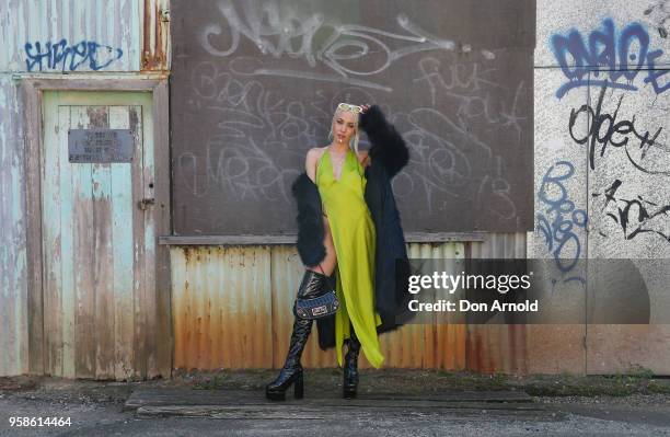 Imogen Anthony wears a dress by Wa La Land, coat by Femme Fatale and boots by Sugar Baby during Mercedes-Benz Fashion Week Resort 19 Collections at...